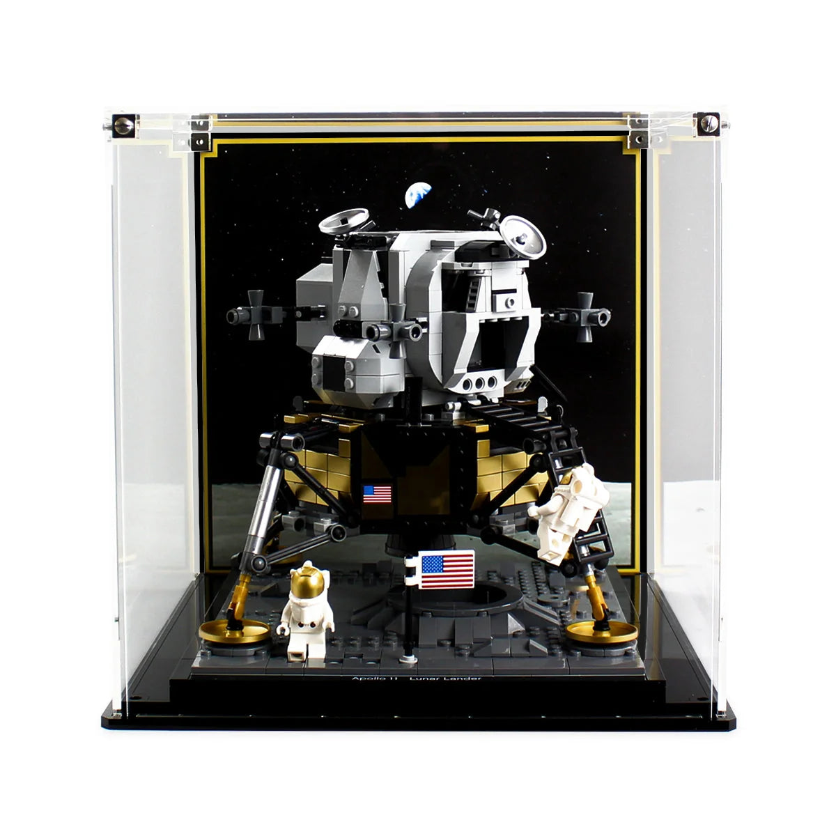 LEGO Apollo 11 Lunar Lander 10266 and astronauts inside a clear display case with a dark space background