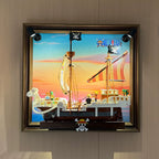 Going Merry wall display frame for LEGO 75639 with spotlights and a sunset backdrop
