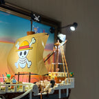 Spotlight detail illuminating the Going Merry sail in the LEGO 75639 wall frame