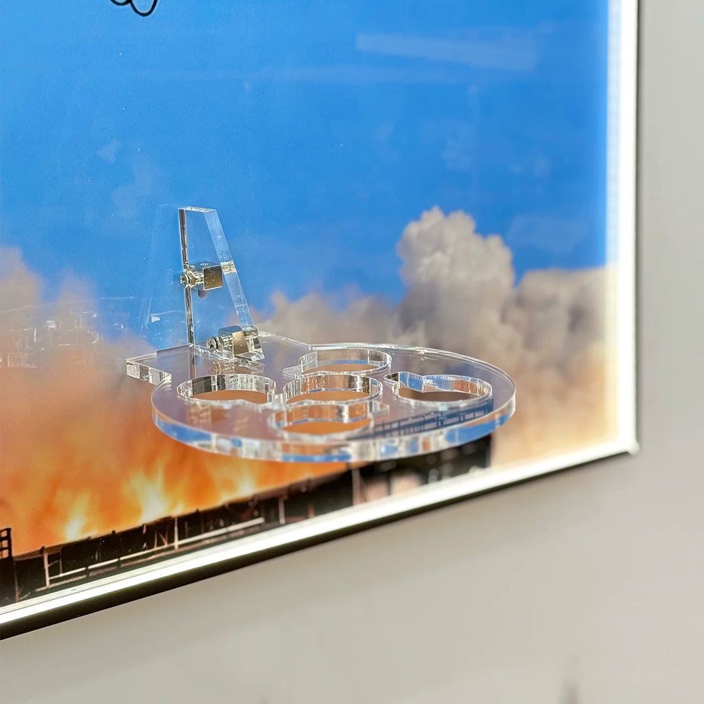 Close-up of clear acrylic support for the LEGO® NASA Apollo Saturn V (21309) wall-mounted display frame