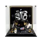 LEGO NASA Apollo 11 Lunar Lander 10266 in a display case with a lunar background