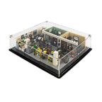 Overhead angle of LEGO The Office 21336 in a low clear acrylic display case