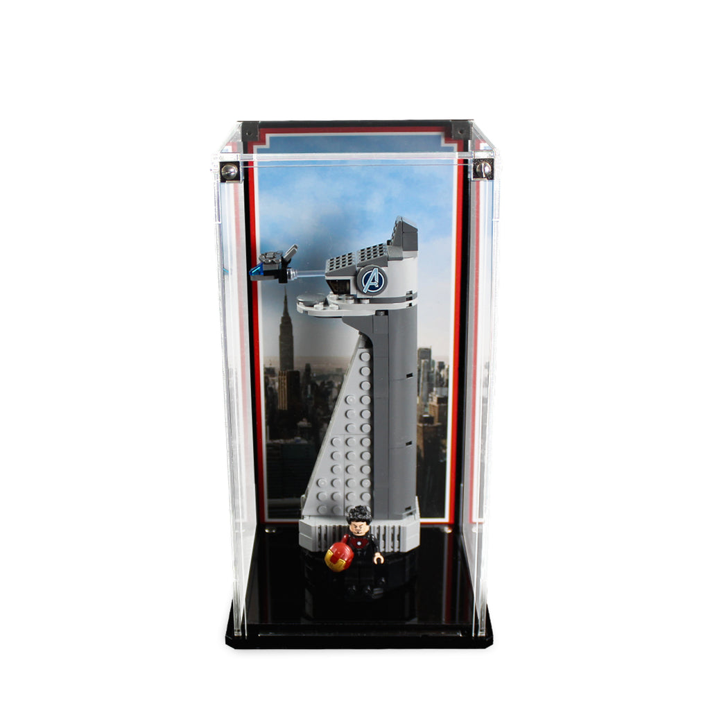 LEGO Avengers Tower 40334 in a tall clear display case with a city skyline background