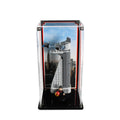 LEGO Avengers Tower 40334 in a tall clear display case with a city skyline background