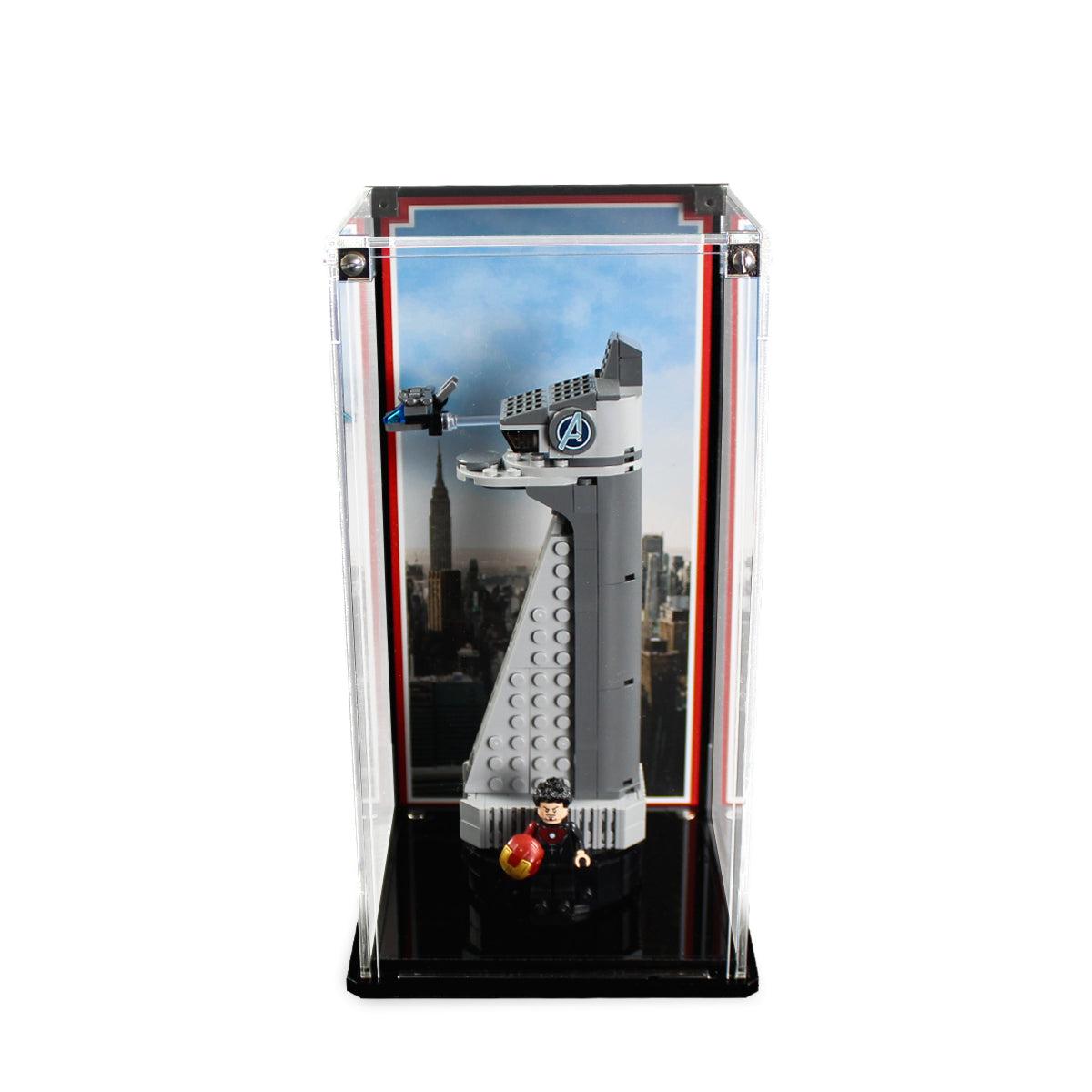 LEGO Avengers Tower 40334 in a tall clear display case with a city skyline background