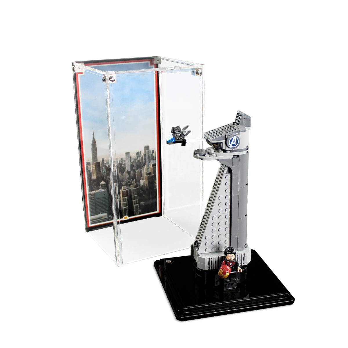 LEGO Avengers Tower 40334 on the black base beside the lifted clear case cover