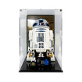 LEGO R2-D2 75308 in a tall acrylic display case with a printed hangar background