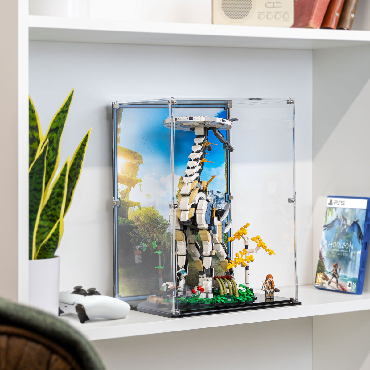 Tallneck 76989 display case arranged on a shelf beside gaming accessories