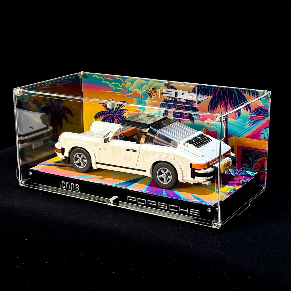 Printed-background display case with LEGO Porsche 911 10295, rear three-quarter view