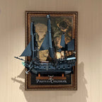 Vintage wall display frame with LEGO Captain Jack Sparrow's Pirate Ship 10365 and a pirate-map backdrop