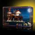 Angled view of an acrylic display case for LEGO Ancient Moon-Gazing Inn 80121 with a raised base and moonlit backdrop.