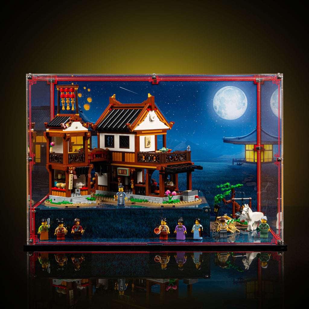 Front view of the Ancient Moon-Gazing Inn 80121 display case with the inn, minifigures and horse arranged inside.