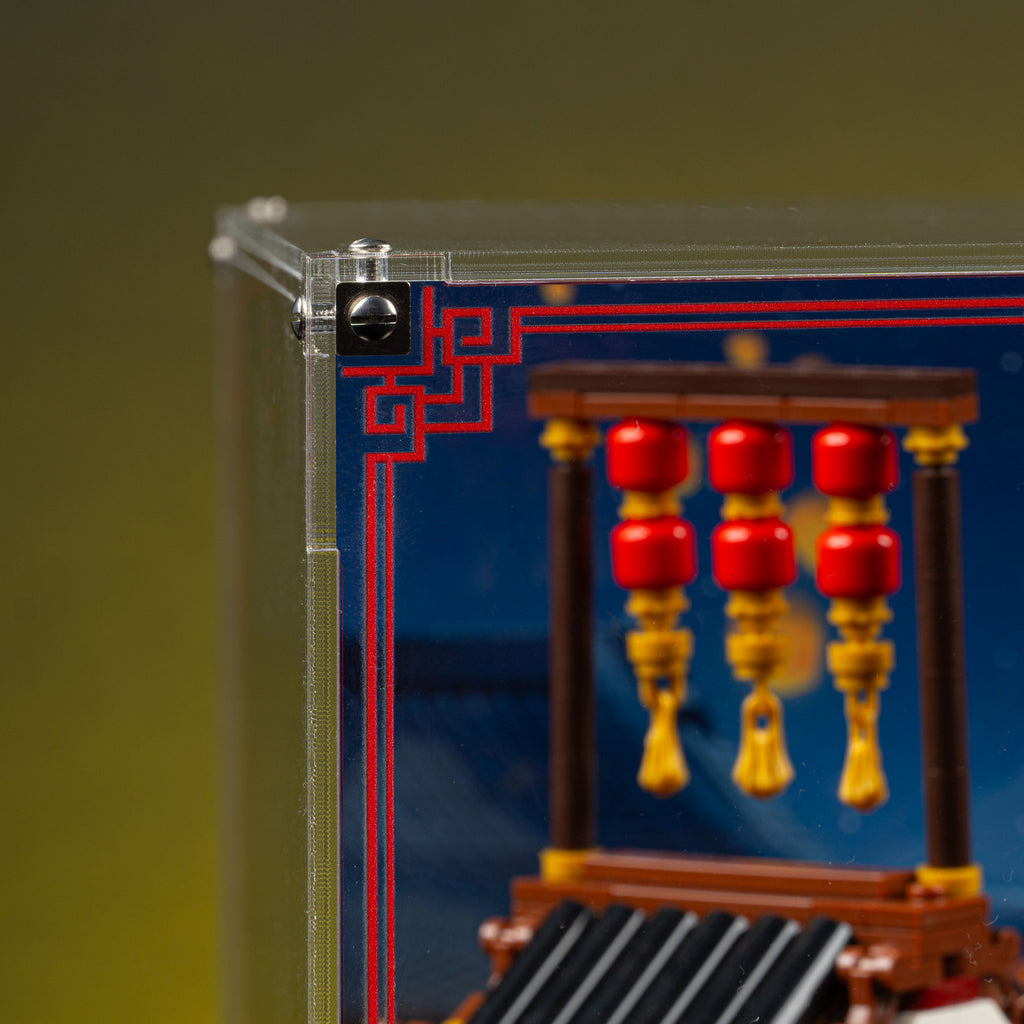 Top-left acrylic corner and red trim beside the lanterns in the Ancient Moon-Gazing Inn 80121 display case.
