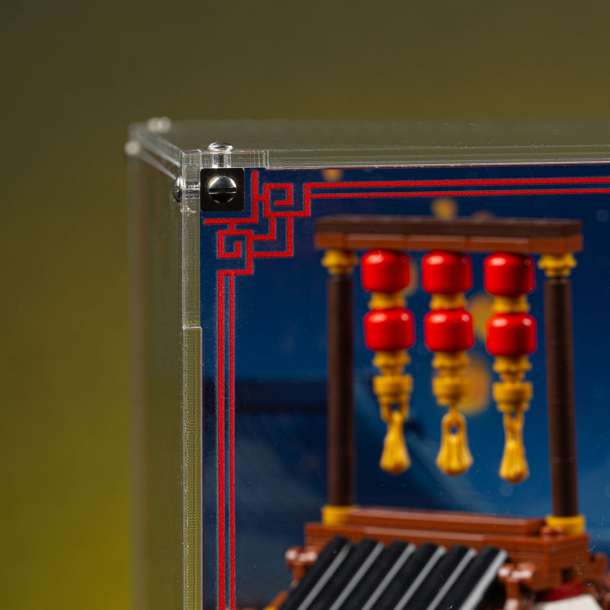 Top-left acrylic corner and red trim beside the lanterns in the Ancient Moon-Gazing Inn 80121 display case.