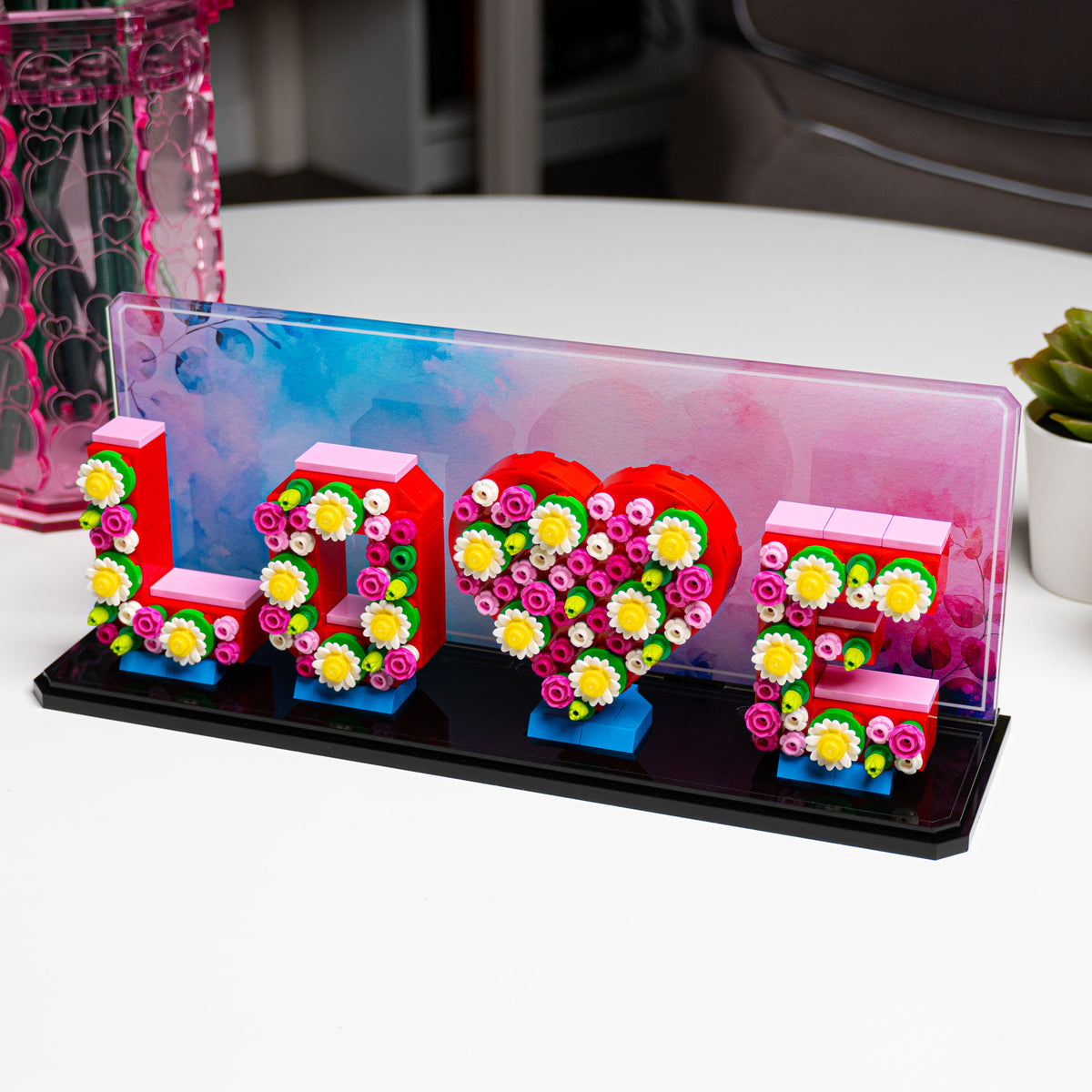 LEGO Love Letters 40867: model and display stand shown together.