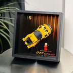 Single-car display frame compatible with LEGO 77239 - Porsche 911 GT3 RS. Car and minifigures not included.