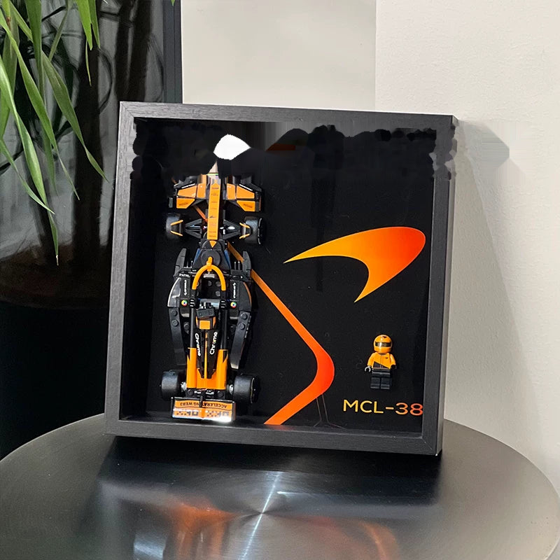 Single-car display frame compatible with LEGO 77251 - McLaren MCL38. Car and minifigures not included.