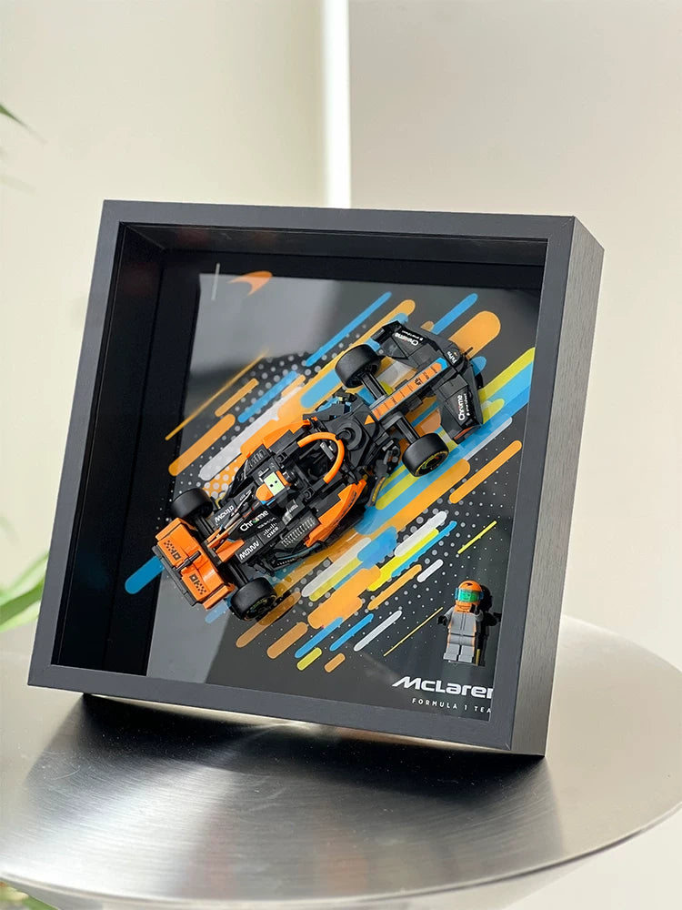 Single-car display frame compatible with LEGO 76919 - McLaren Formula 1 Race Car. Car and minifigures not included.