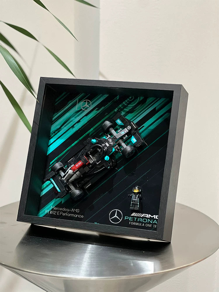 Single-car display frame compatible with LEGO 76909 - Mercedes-AMG F1 W12 E Performance. Car and minifigures not included.