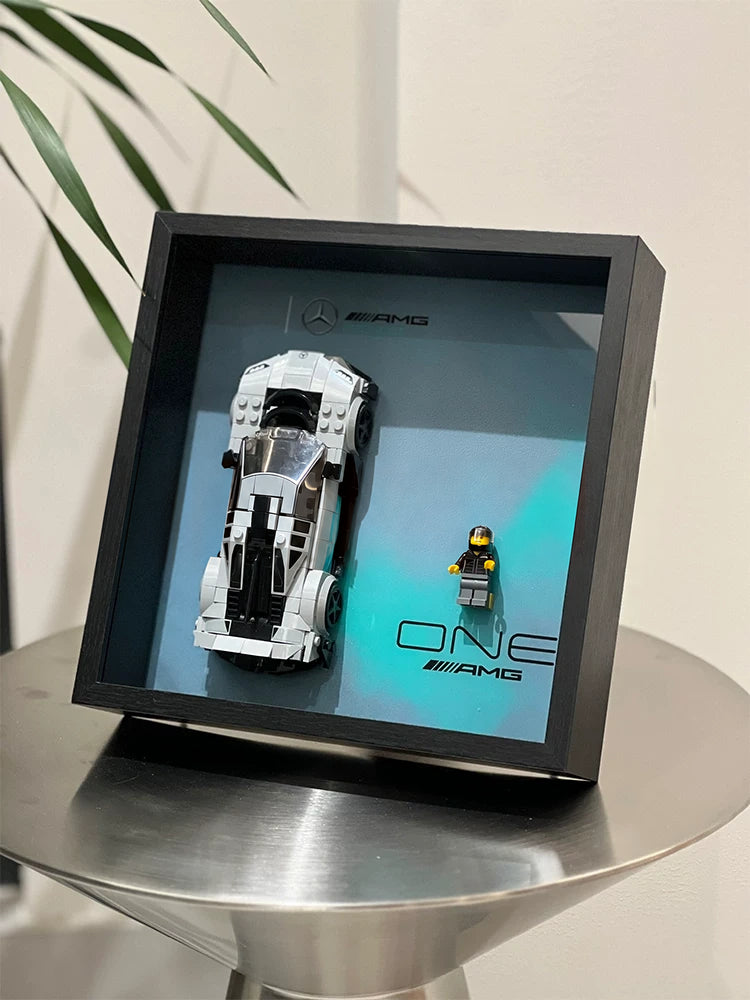Single-car display frame compatible with LEGO 76909 - Mercedes-AMG Project One. Car and minifigures not included.
