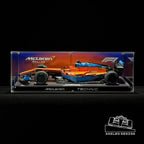 Angled acrylic display case for LEGO McLaren Formula 1 Race Car (42141), full side view with printed backdrop